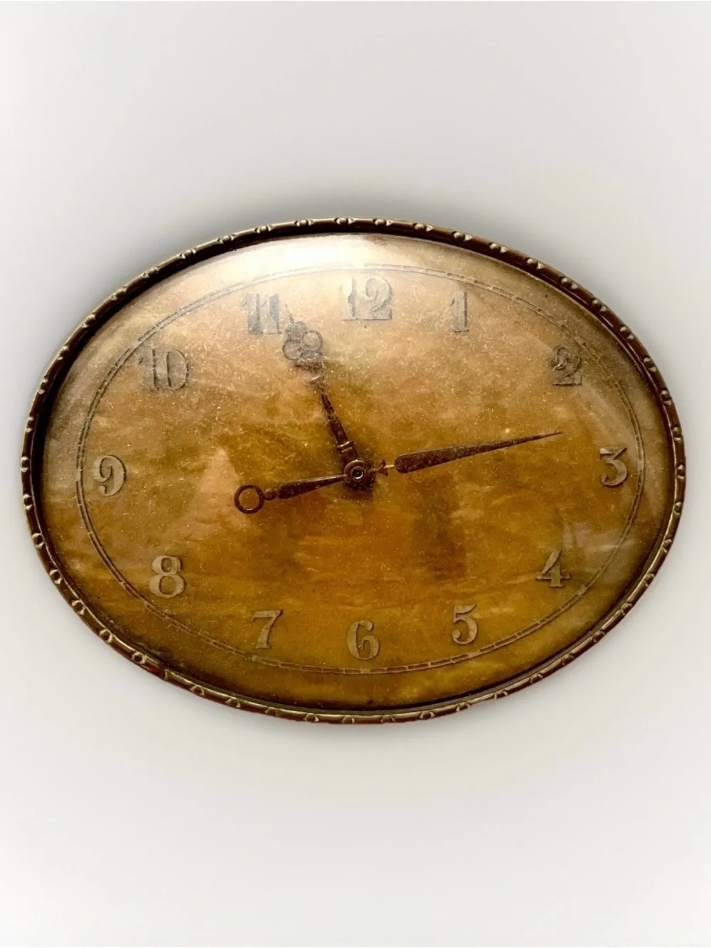 Vintage Oval brass Clock. 5” wide on brass stand